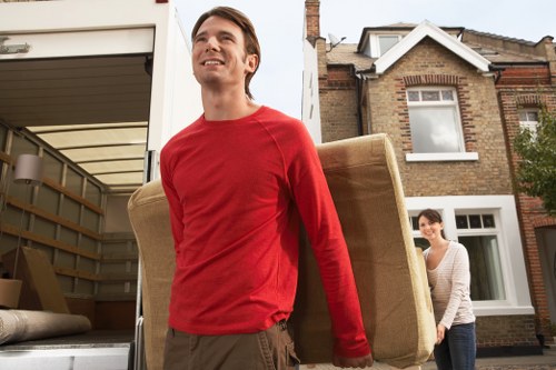 Professional removals team handling furniture during a Brunswickpark move